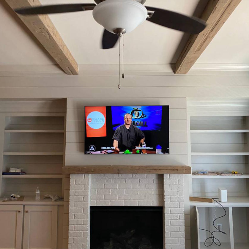 TV mounted on wall in Milwaukee WI living room by Handy Dandy Tech